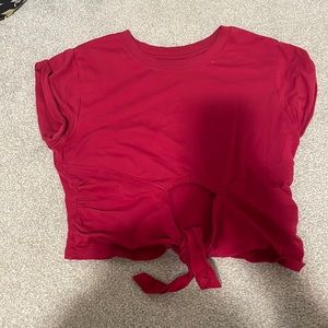 Red urban outfitters tie front crop top. Size small. Has a small cot out.